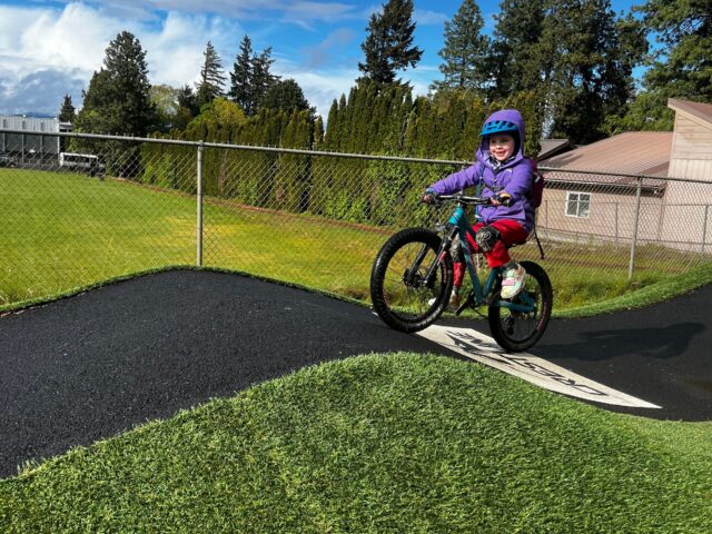 Little girl riding her bike at Golden Eagle Pump Track in Hood River