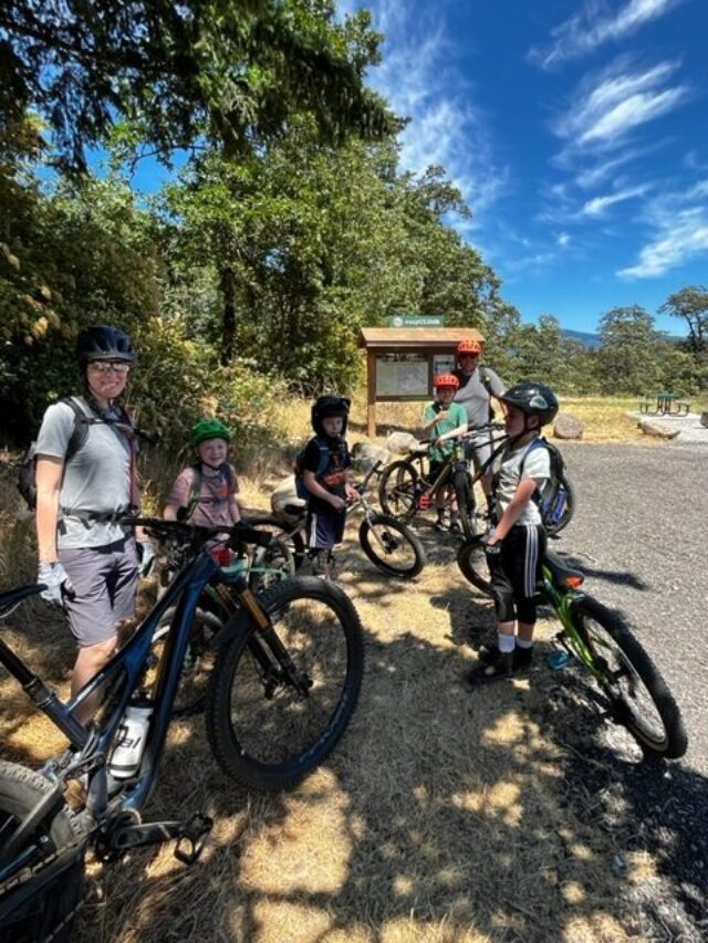 A group of parents and adults mountain biking at Easy Climb Trail in Cascade Locks, Oregon